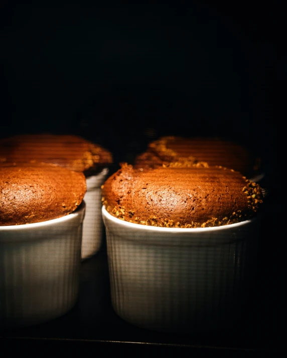 two baked cakes sitting side by side in a bowl