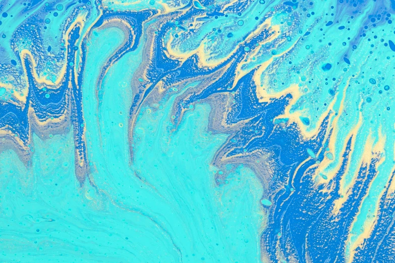 some blue liquid on a blue and gold surface