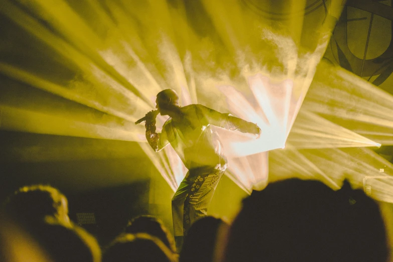 a man standing in the middle of a crowd of people