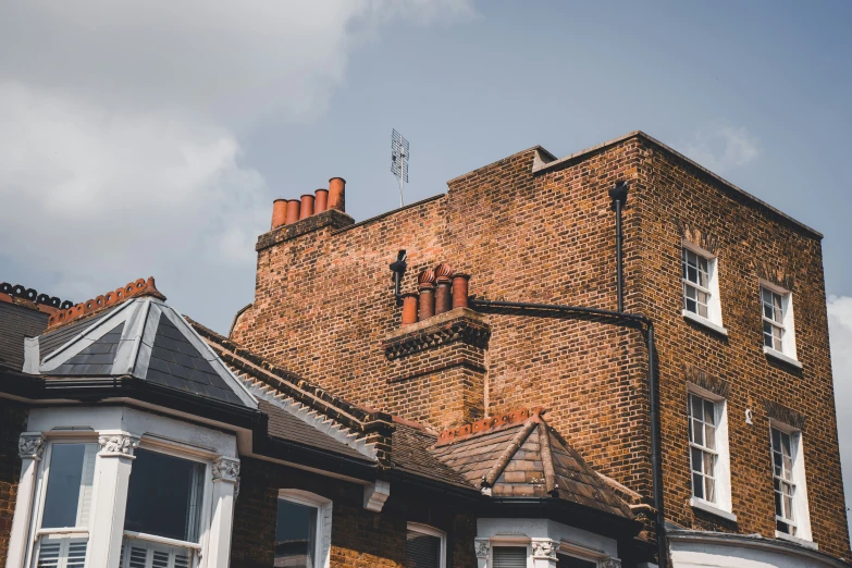 a brick building is shown on a clear day