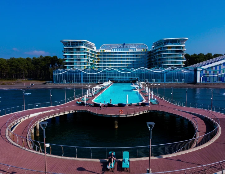 a large swimming pool surrounded by many blue buildings