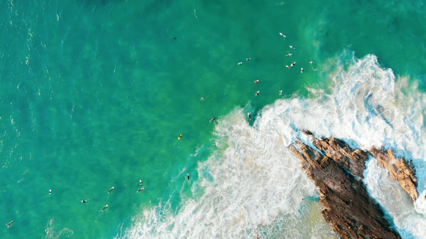 some surfers are riding on their surf boards