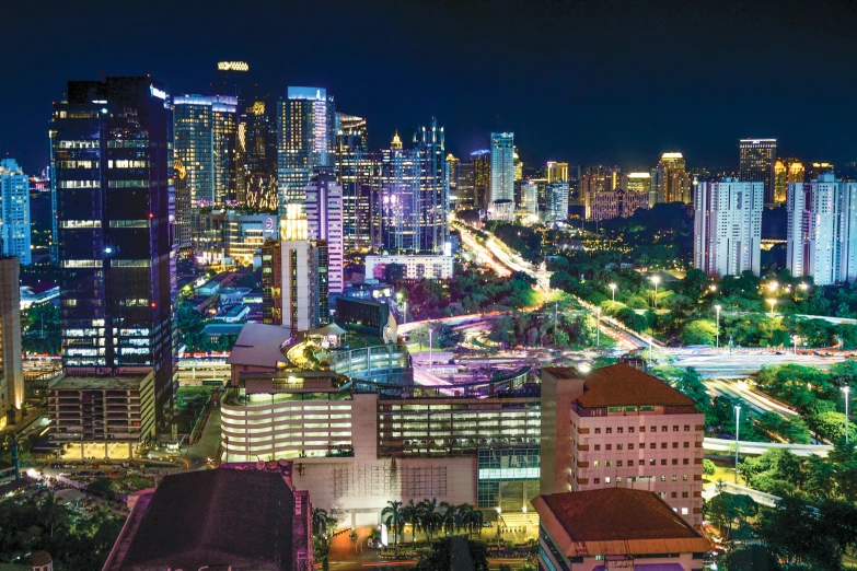 view from top of buildings of city at night time