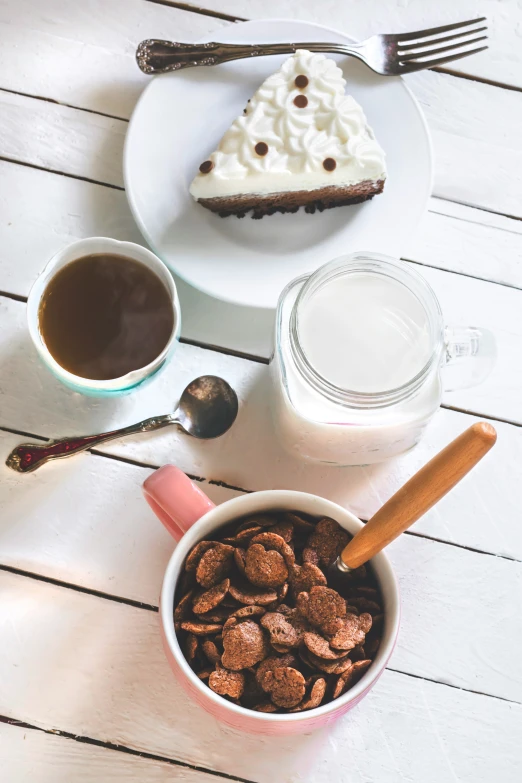 a plate with a piece of cake and a bowl of cereal