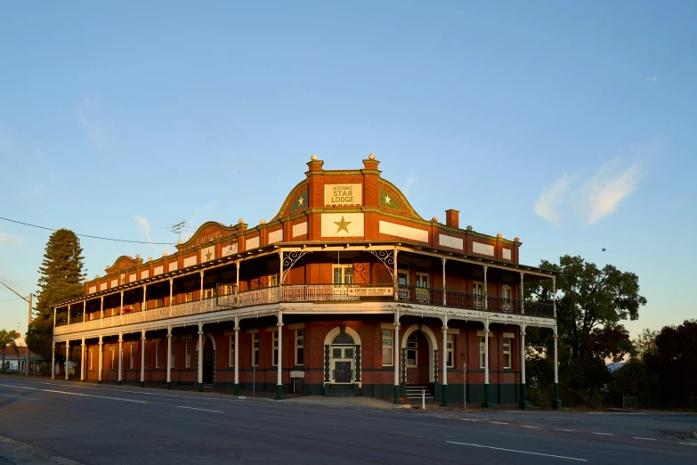 an old red brick building with a clock on the top