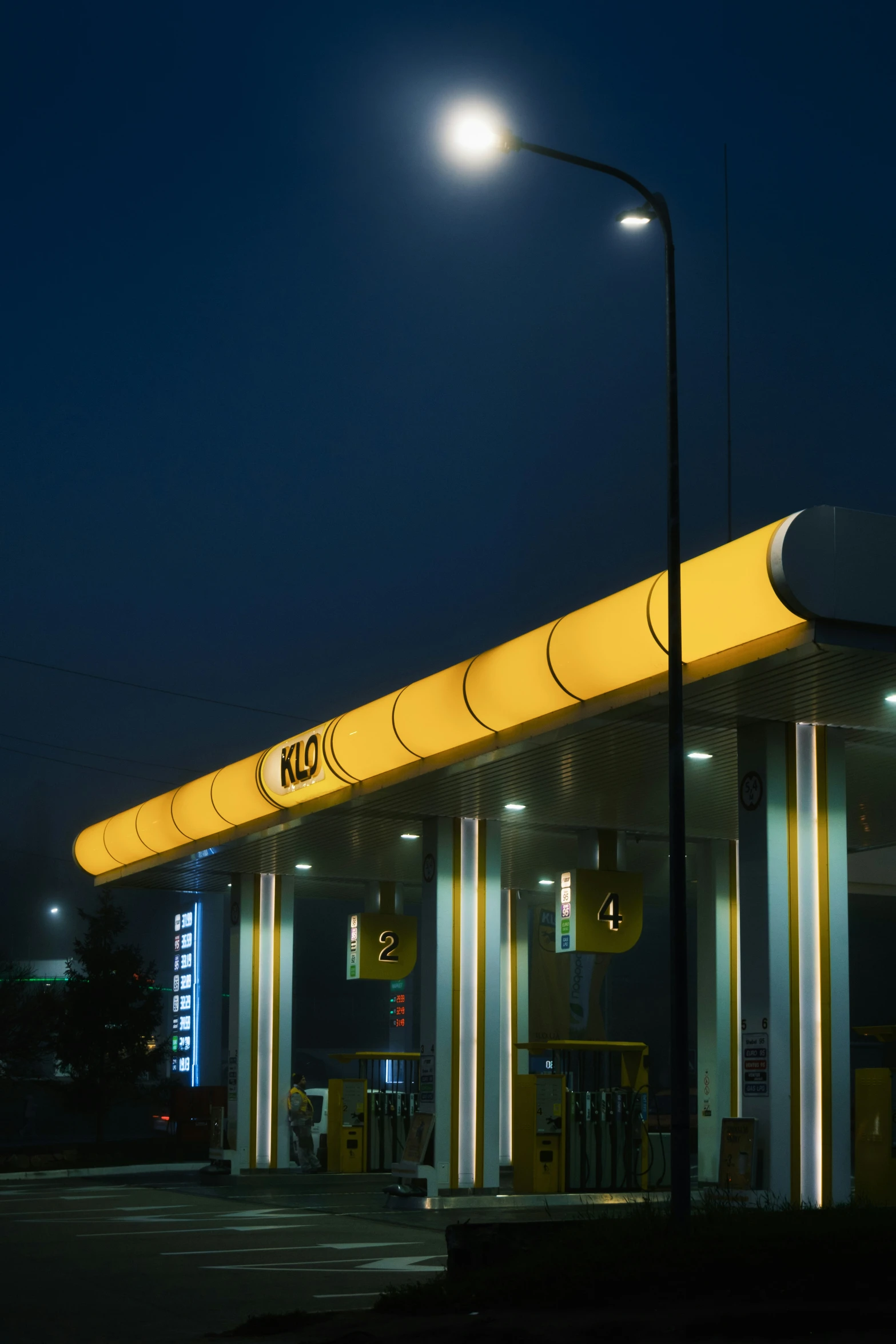 this gas station is lit up at night