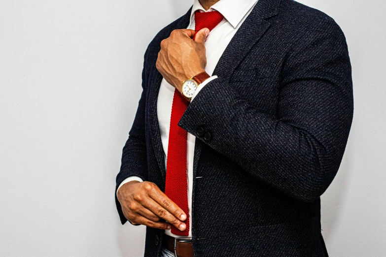 a man wearing a red tie and jacket