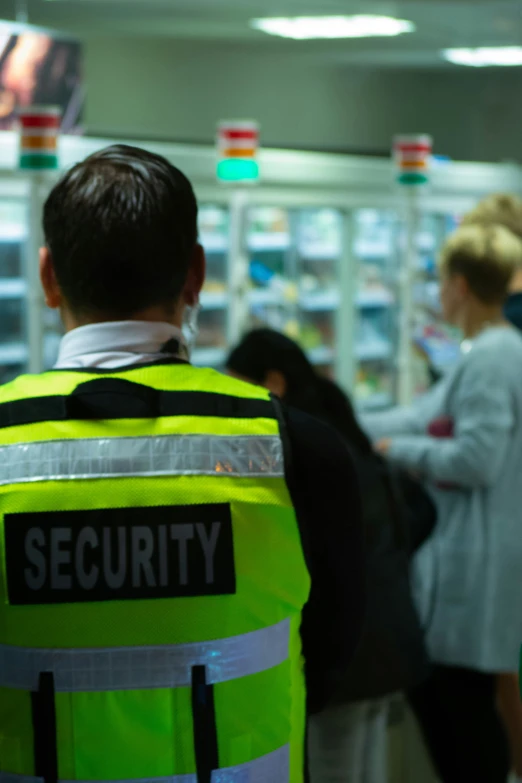 two security guards standing in front of a store