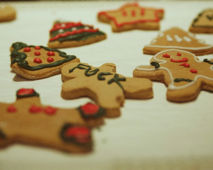 a table topped with cut outs of ginger cookies