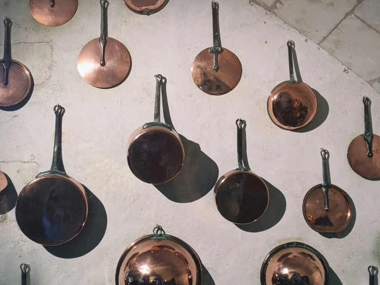 lots of pots and pans on display in a store