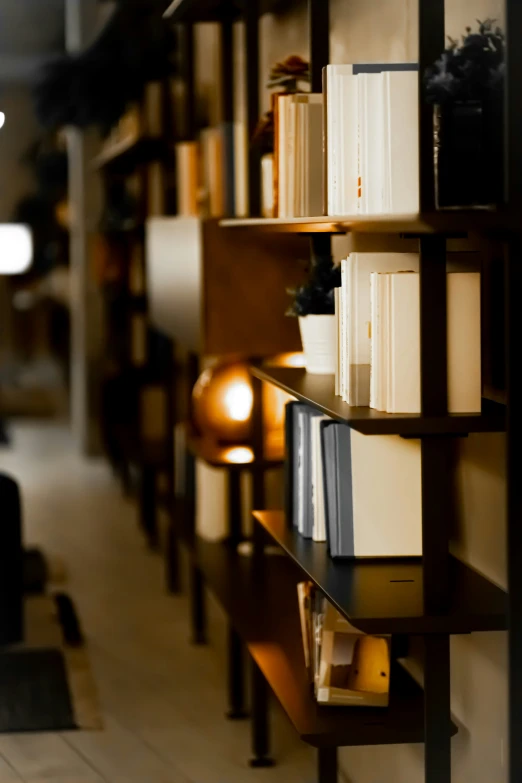 a bookshelf with books and candles all around