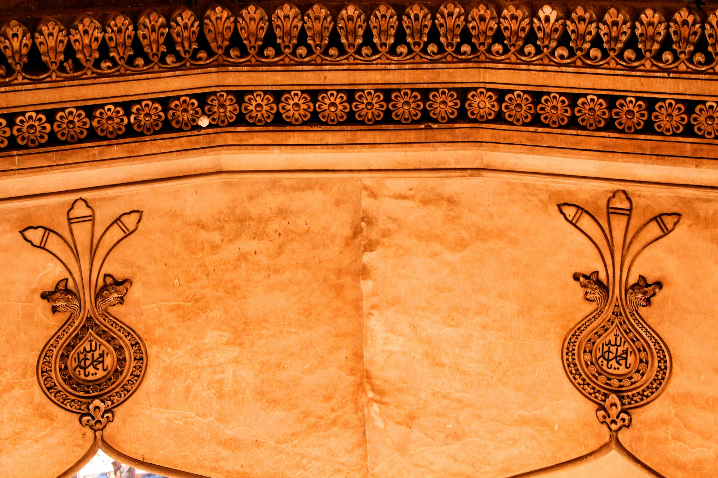 an ornate design on a wall in the forbidden city