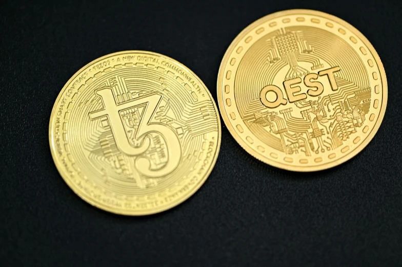 an image of two gold bitcoins