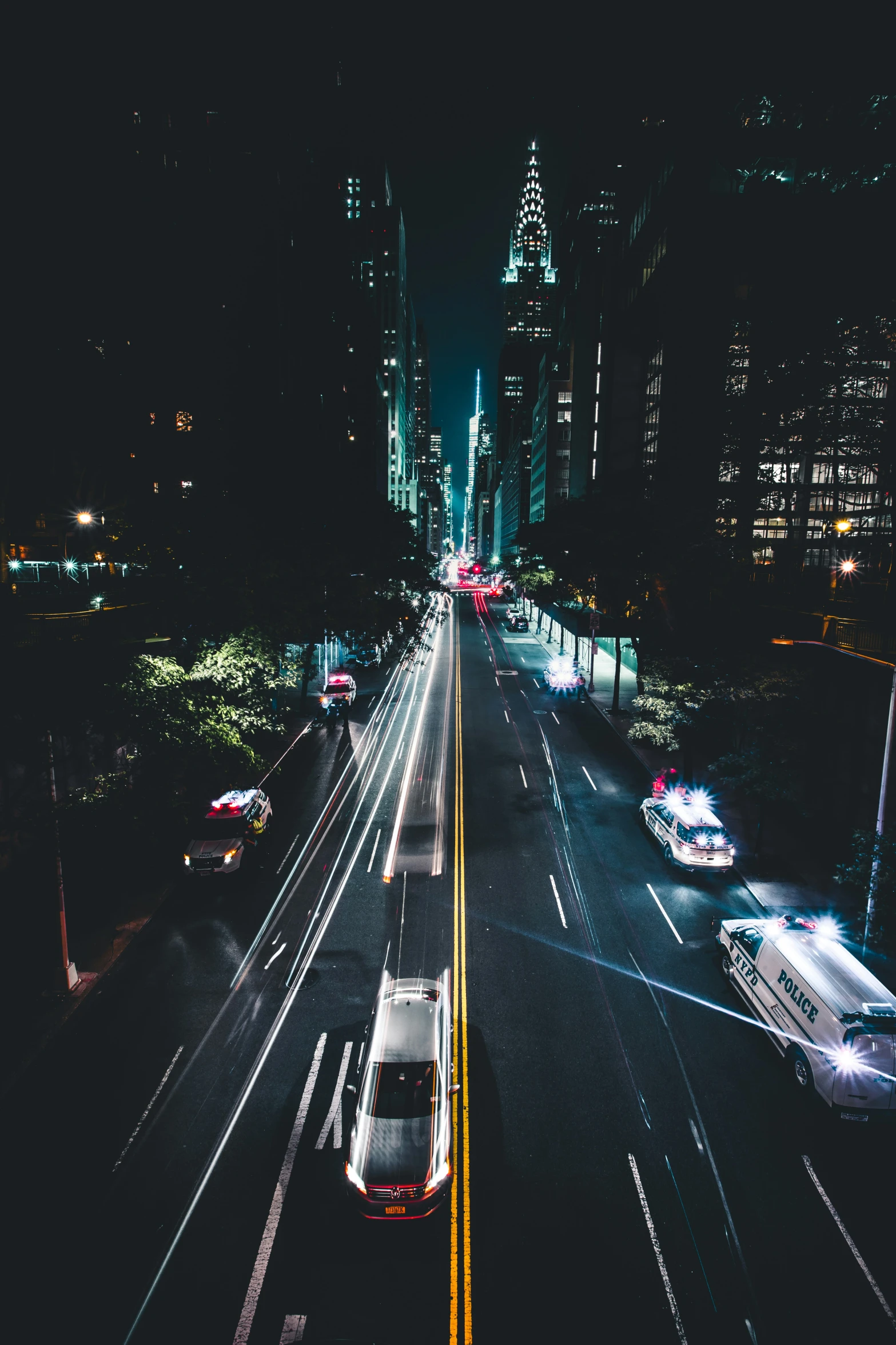 a long stretch of city street at night time