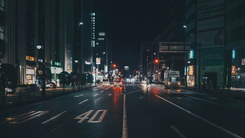 city street at night with a rainy street lights