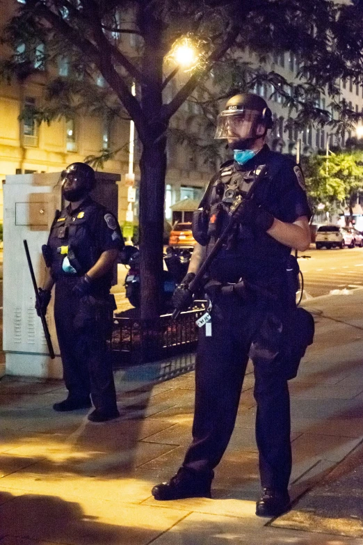 the cop and the police officer are talking on the side walk