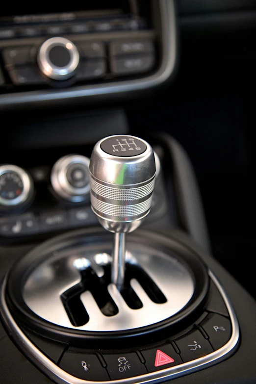 the gear stick controls on the steering wheel of a car