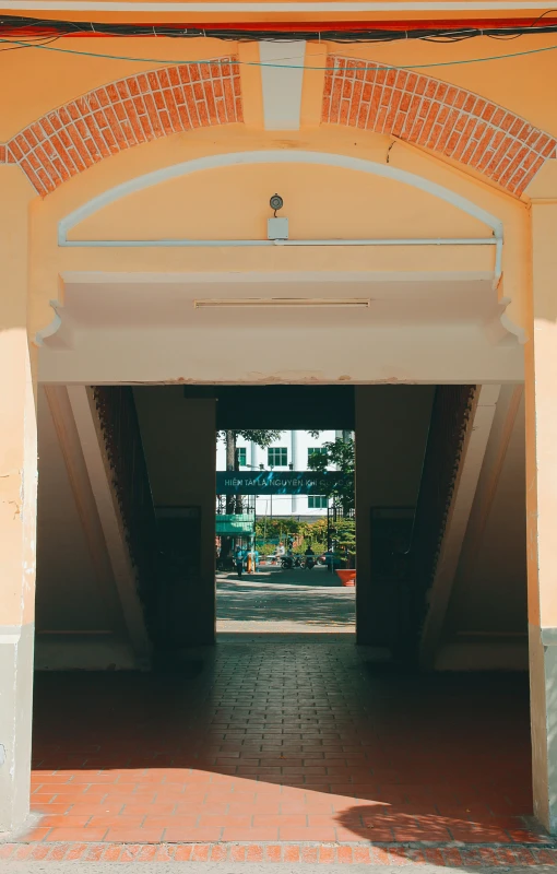 a po taken from below of a large brick archway