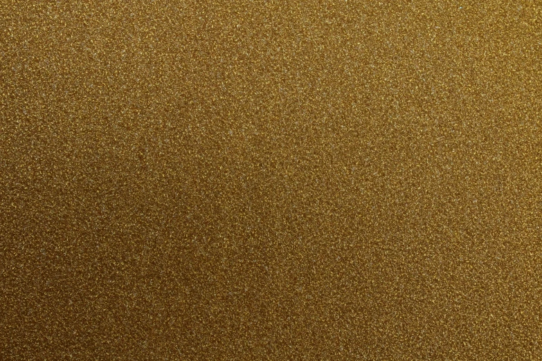 a closeup of a gold glitter textured backdrop