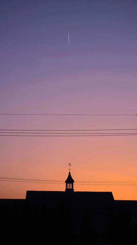 the spire of a building with a clock on it