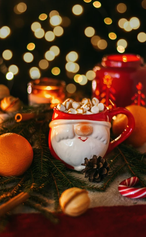 a couple of christmas cups sitting on top of a table