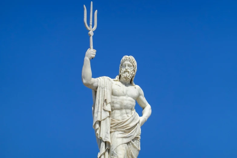 statue of a god holding up a sceptacle