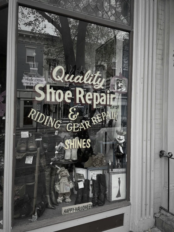 a retail window of shoe repair and repair