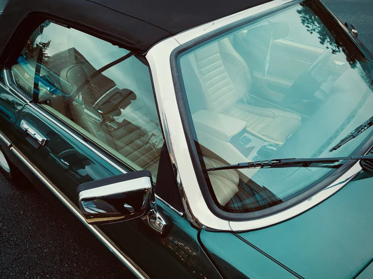 an older model car parked on the side of a street