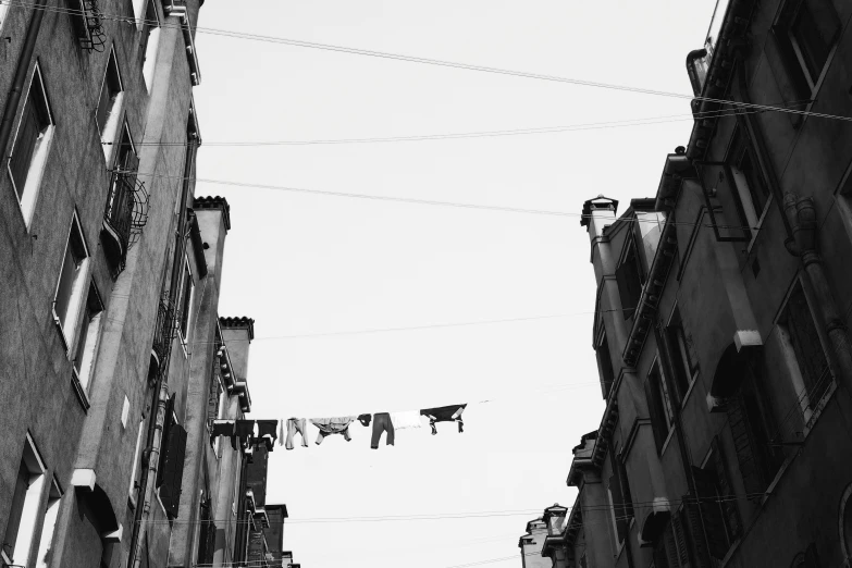 laundry lines hanging from a rope in a street