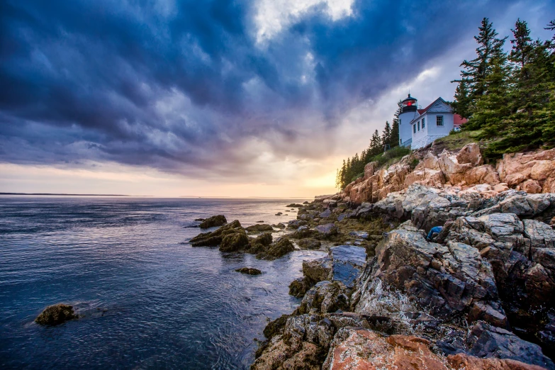 a light house on the coast near the water