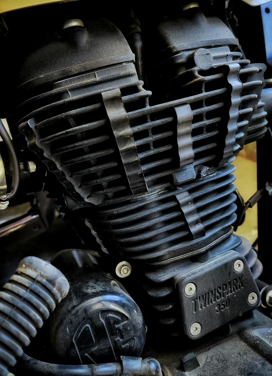 close up of the engine part of an older motorcycle