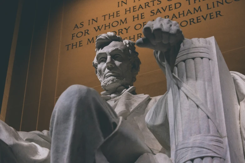 a very large statue with a lincoln memorial behind it