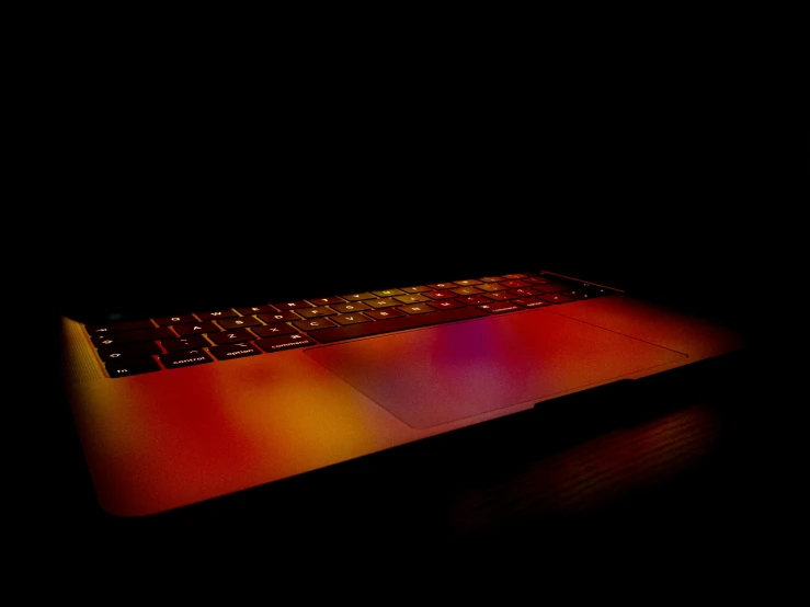 the light shines brightly from the top of a computer keyboard