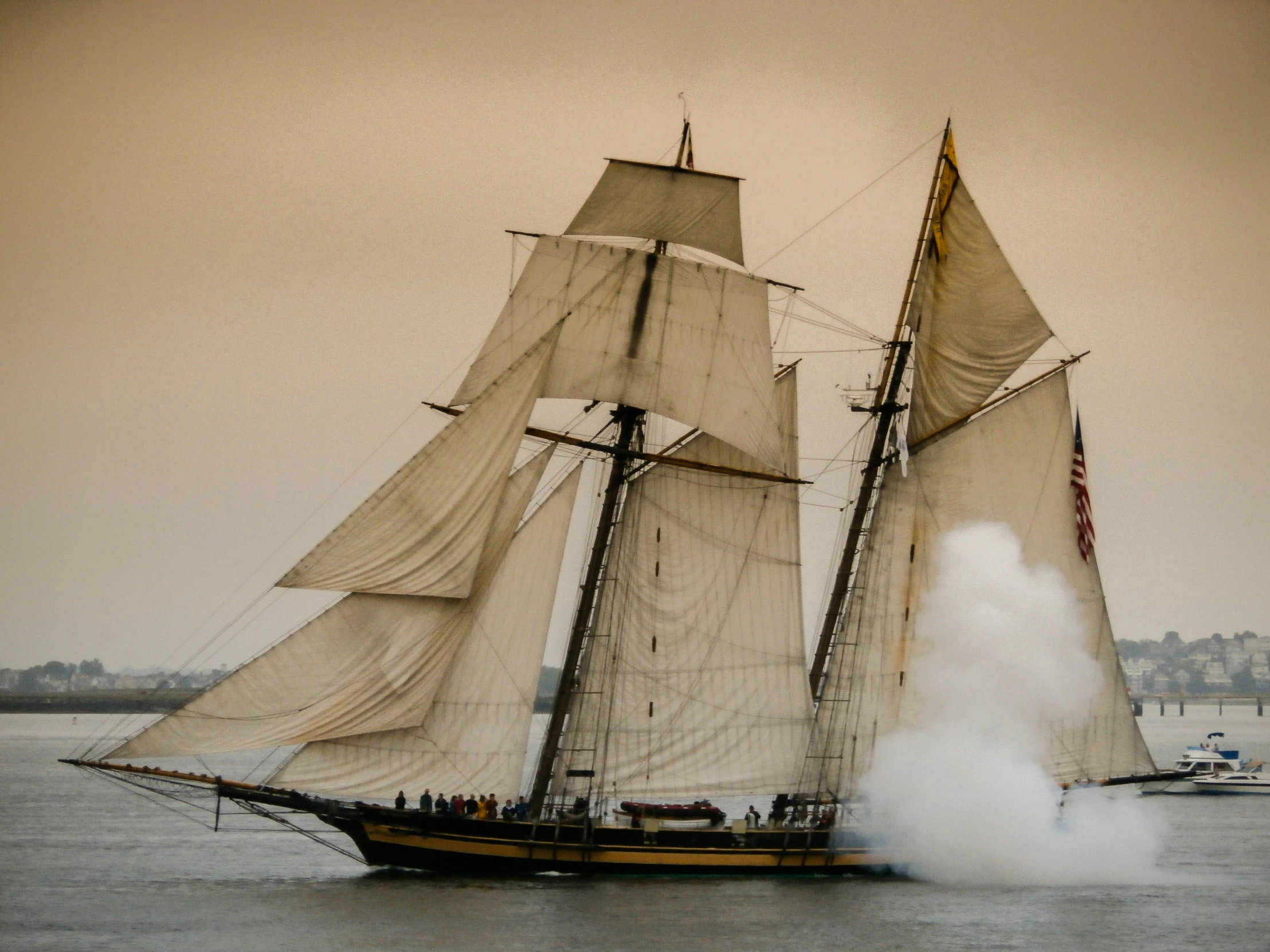 an old timey looking sailboat in the water