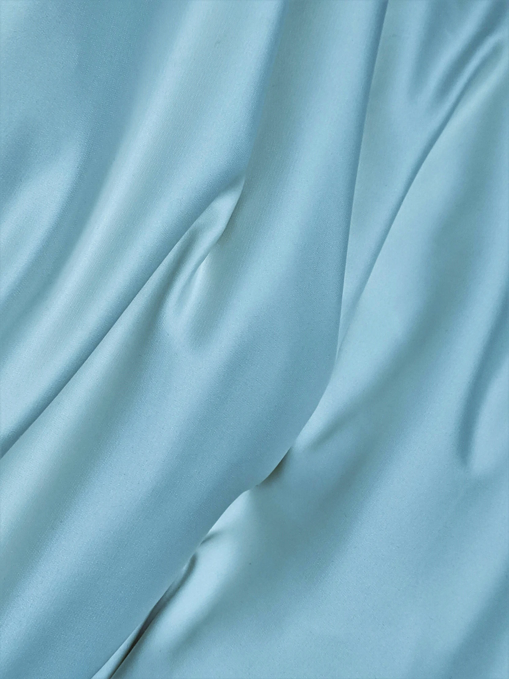a close up of a soft blue fabric