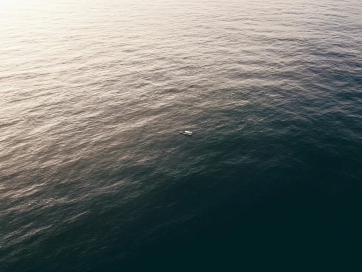 a boat in the middle of the ocean