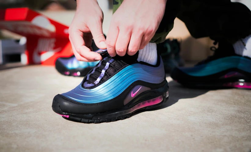 a person putting on a colorful nike air max