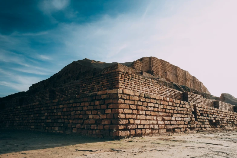 the brown brick structure has several pieces of construction