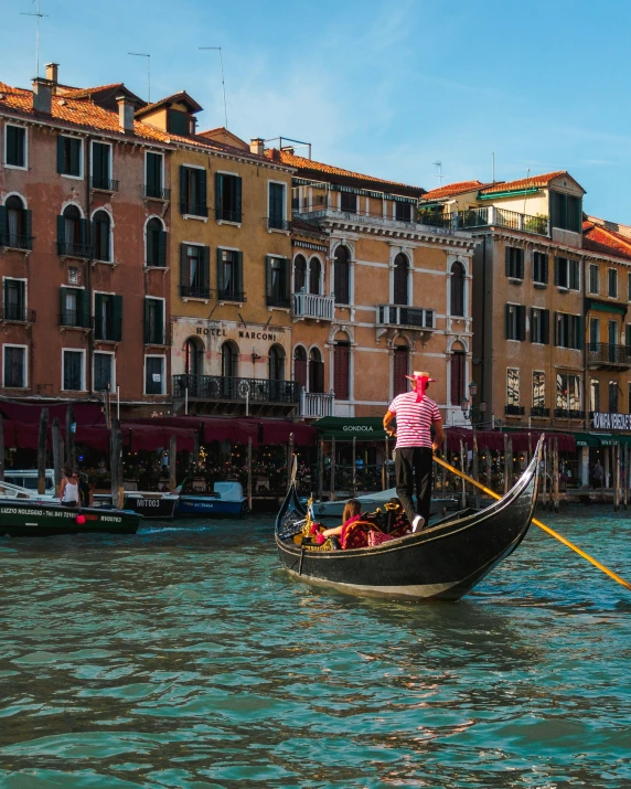 a couple of men on a boat in the water