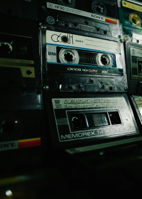 several old stereos sit next to each other in a room