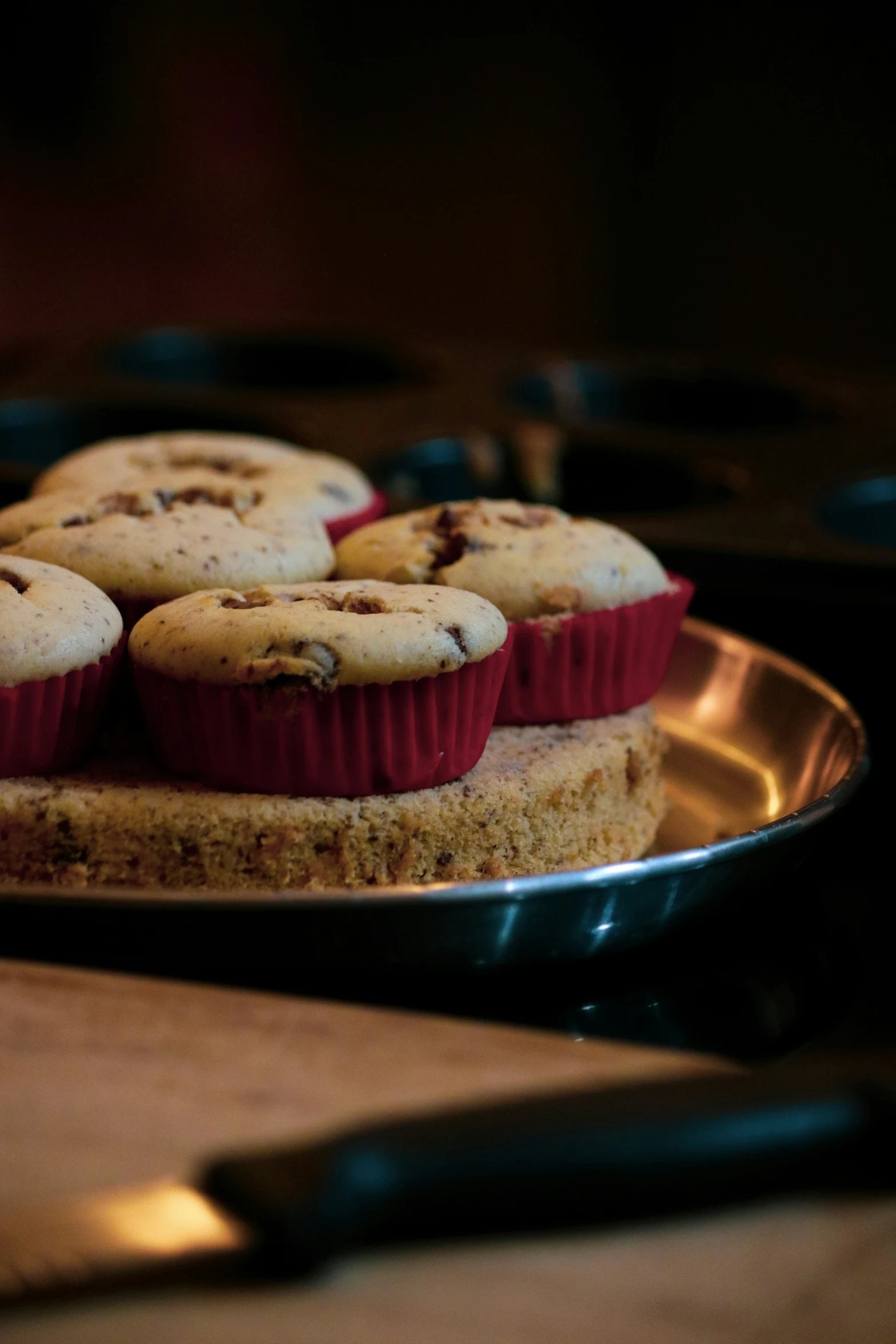 there are several chocolate chip muffins on a metal tray