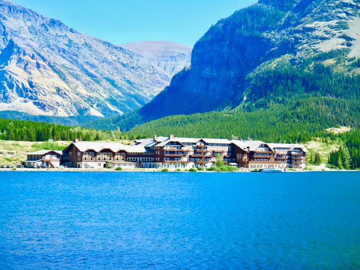 an outdoor area by the water near a mountain