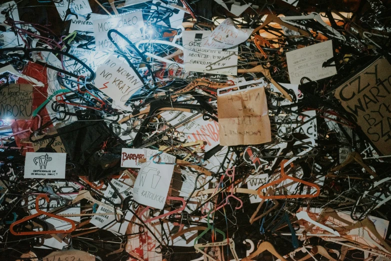 a pile of wires and various paper tags and pins