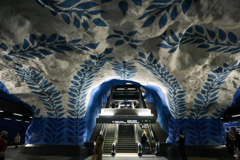 a building with a stairway painted in blue