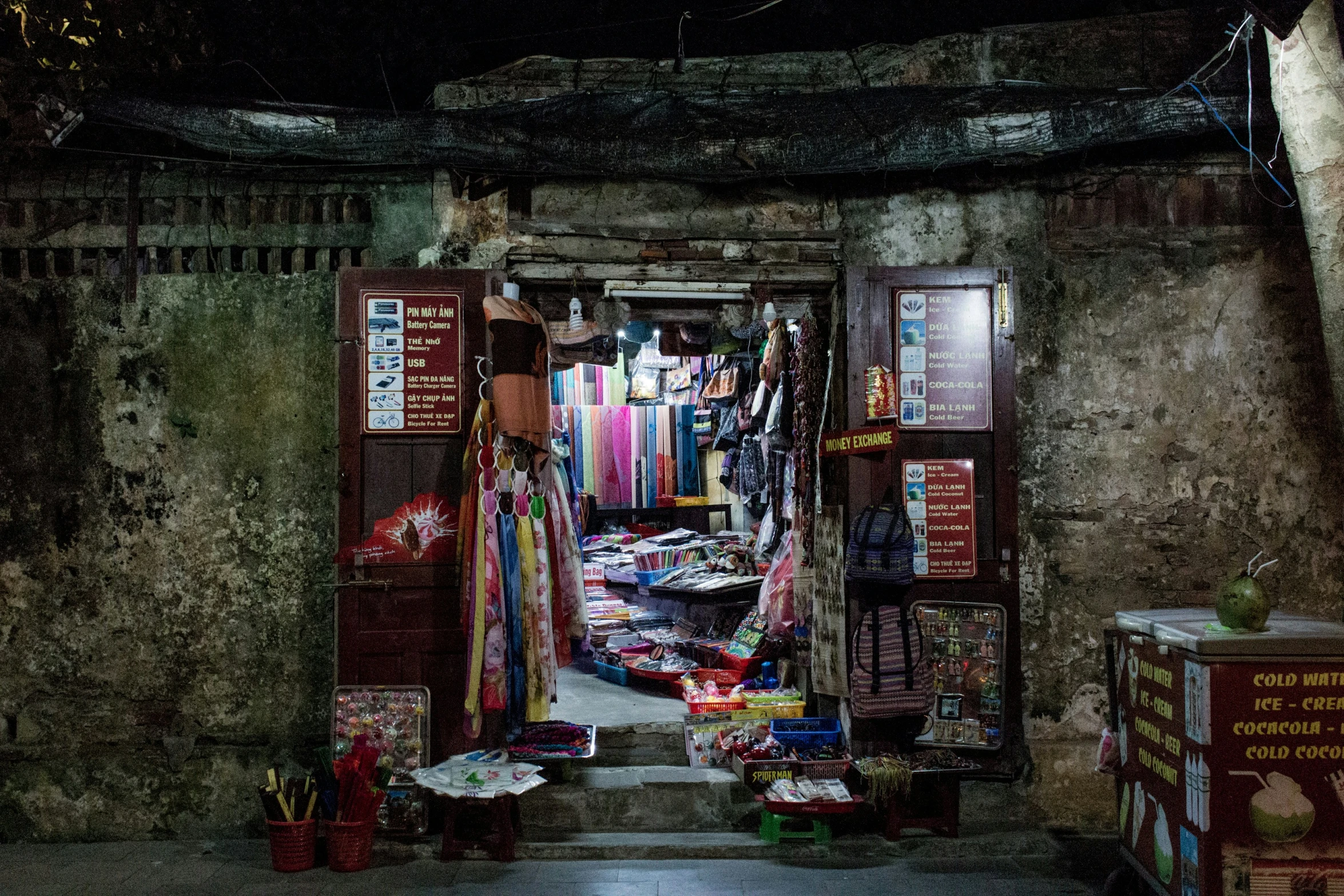 a street scene with a market at night