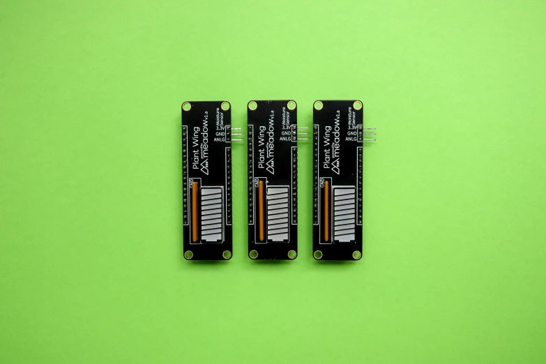 two batteries on a green background