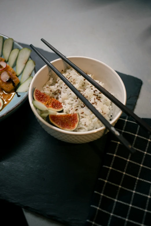 two bowls of food are on a table