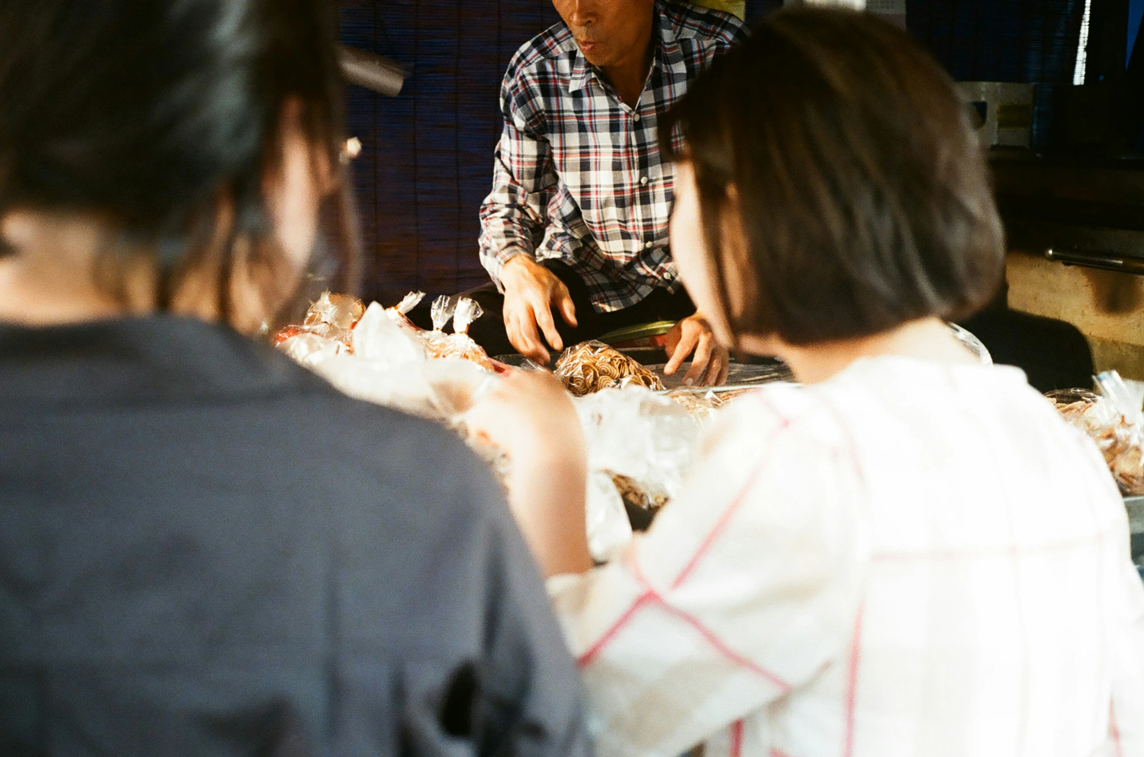 an older gentleman serving a young woman at a party