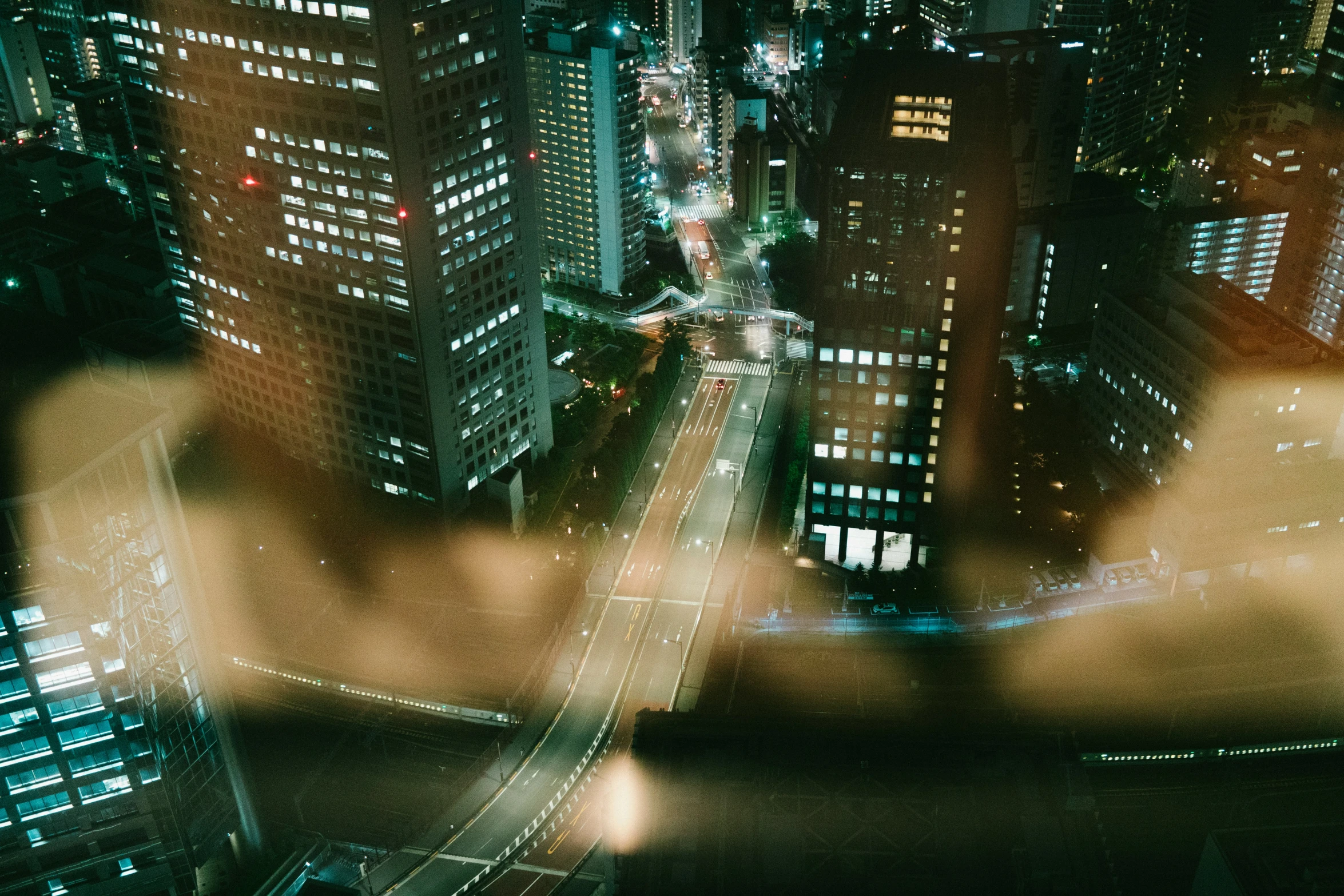 an aerial view of buildings in a city at night