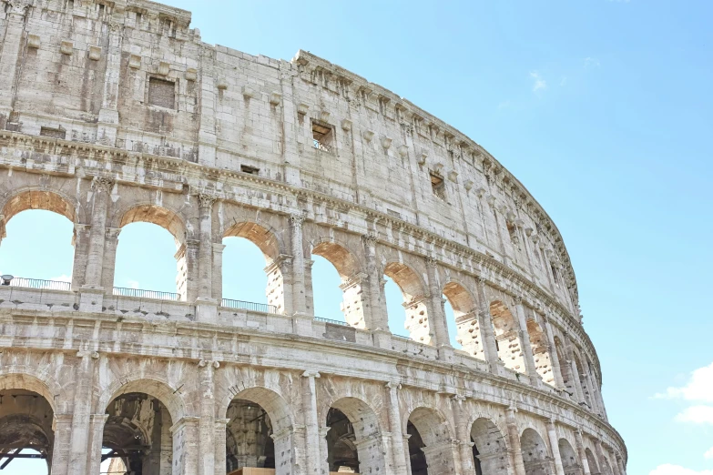 the top and sides of an ancient arena, with some archivilations and arched doorways